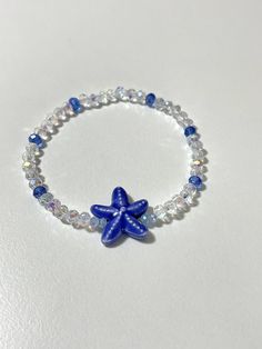 This will come with the pattern and color beads in the picture, and a blue starfish.                                                  * NOTE:*                         The bracelet in the picture is 6.5 inches.                         If you pick a different size the pattern           of beads in the back will be slightly different.  ANY QUESTIONS AT ALL OR CUSTOM ORDERS PLEASE DON'T HESITATE TO MESSAGE ME I WILL GET BACK TO YOU ASAP! -Please roll-on bracelets to avoid   over-stretching. -As with Cheap Ocean-inspired Beaded Bracelets For Gift, Cheap Ocean-inspired Beaded Bracelet, Cheap Blue Bracelets With Starfish Charm, Beachy Bracelets Beads, Adjustable Blue Starfish Jewelry, Adjustable Blue Bracelets With Starfish Charm, Blue Bracelet With Starfish Charm And Round Beads, Blue Bracelets With Starfish Charm And Round Beads, Blue Bracelets With Starfish Charm Ocean-inspired