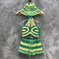 Rasta 3 piece crochet outfit Halter crop top, shorts and panama hat matching set Granny square crochet set woman Beach festival gift her Material: cotton, microfiber Colour: yellow, green and black Size: choose in variations! Pretty festival 3 piece rasta crochet outfit for woman. In this handmade unique outfit you will be unforgettable! Size chart women XS: Chest: 32.3"/ 82 cm Waist: 24.4"/ 62 cm Hips: 35.4"/ 90 cm S: Chest: 33.9"/ 86 cm Waist: 26"/ 66 cm Hips: 37"/ 94 cm M: Chest: 35.4"/ 90 cm Waist: 27.5"/ 70 cm Hips: 38.6"/ 98 cm L: Chest: 37.8"/ 96 cm Waist: 30"/ 76 cm Hips: 41"/ 104 cm XL: Chest: 40.15"/ 102 cm Waist: 32.3"/ 82 cm Hips: 43.3"/ 110 cm For more crochet outfits for women's, click here: https://www.etsy.com/shop/Garust?ref=seller-platform-mcnav&section_id=35266619 Garust Green Summer Crochet Top For Vacation, Green Summer Crop Top For Vacation, Green Summer Style Crop Top For Vacation, Green Crochet Top For Summer, Two-piece Crop Top For Summer Vacation, Handmade Summer Crop Top For Vacation, Green Crochet Top For Beach Vacation, Crochet Summer Hat For Vacation, Handmade Beachwear Crop Top For Summer