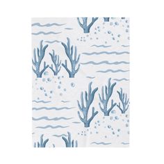 a blue and white wallpaper with corals on it