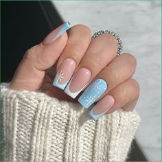 This wintery design combines icy light blue with intricate snowflakes, creating a frosted and elegant look. Perfect for the winter nails square 2024 – 2025 trend, this set embraces the magic of winter. The square nail shape adds structure, while the snowflake accents give a delicate, seasonal charm. The blue and nude color combination keeps the design simple yet festive, making it a great inspo for those looking to embrace winter designs. Winter Color Nail Designs, Colorful Winter Nails, Nokti Za Zimu, Square Nail Designs Winter, Winter Season Nails, Holiday Nail Designs Winter, Cute Winter Nail Designs, Nails Snow, Short Christmas Nails