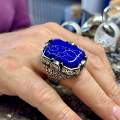 Man Silver Lapis Lazuli Ring, Blue Lapis Signet Ring, Engraved Men Silver Ring, Large 925k Sterling Silver Ring , Father Day, Gift For Him ★Item Details * Gender : Male / Female * Material : 925K Sterling Silver * Total weight :  45 Grams * Gemstone :  Lapis Lazuli Stone * Stone Size  : 22x30mm ✔ Ready to Ship in 1-2 Business Days .. ✔ Shipped to the Worldwide 1-5 business days with free shipping... ✔ The product will be sent to you with a handmade wooden box to avoid any damage during shipping... ✔ Visit our store, browse other Men's jewelry, silver and gold collections, and find the perfect piece you're looking for... -All Countries 3 - 7 Days -All Products Are Sent With Tracking Number. ( TNT , UPS , PTT ) Click For Our Other Products  https://www.etsy.com/shop/MercansilverTR?ref=simple Blue Polished Signet Ring As Gift, Blue Polished Finish Signet Ring As Gift, Blue Signet Ring With Polished Finish For Gift, Blue Signet Ring With Polished Finish As Gift, Luxury Carved Blue Jewelry, Luxury Blue Carved Jewelry, Sterling Silver Signet Ring With Sapphire For Gift, Blue Sterling Silver Signet Ring With Gemstone, Sapphire Sterling Silver Signet Ring As Gift