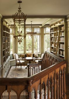 a living room filled with furniture and a chandelier