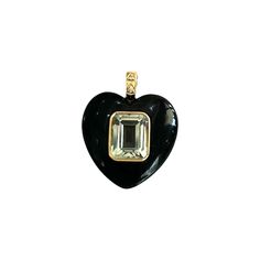 Heart charm features hand carved black onyx, crystal center stone & 18k yellow gold. Bail features white diamonds. If out of stock please allow 6-8 weeks for delivery. 18k yellow gold Green amethyst center stone Approx. 1" all the way around 0.01ctw diamond Van Den Abeele Black Diamond Heart-shaped Jewelry, Black Heart-shaped Diamond Jewelry, Black Luxury Enamel Jewelry, Black Enamel Pendant Jewelry, Black Intaglio Jewelry As A Gift, Luxury Black Heart Pendant Jewelry, Black Onyx Crystal, Onyx Crystal, Yellow Citrine