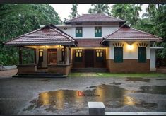 a house that is sitting in the rain