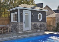 a backyard with a pool, table and chairs