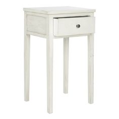 a small white table with drawers on it