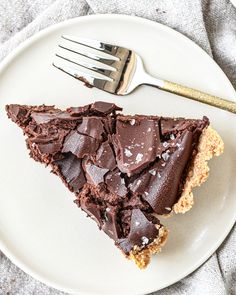 a piece of chocolate pie on a plate with a fork