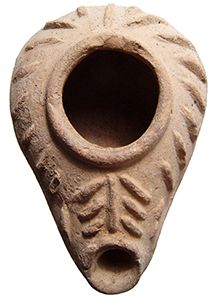 an old clay vase is shown against a white background