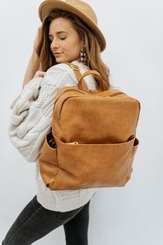 say hello to our latest backpack, the everly! this beauty is stunningly simple and lets its functionality be the star. which isn't to say that the everly is ordinary - that couldn't be further from the truth. it's unique shape, luxe gold hardware, and multiple pockets prove the everly is not a bag to be ignored. we ado Beauty Makeup Tips, Boot Bag, Modern Chic, Diaper Backpack, Chic Boutique, Carry On Bag, A Bag, The Star, Sling Backpack