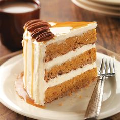 a slice of carrot cake on a plate with a fork