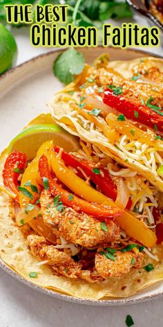 the best chicken fajitas with peppers, onions and cilantro on a tortilla