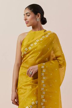 Mustard yellow saree in silk organza base with silver and gold aari and sequin work. Paired with a halter neck blouse and petticoat. - Aza Fashions Aari Work Saree, Mustard Yellow Saree, Prakash Silks, Halter Neck Blouse, Halter Neck Blouses, Yellow Saree, Yellow Blouse, Work Sarees, Aari Work