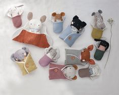 there are many stuffed animals in these little purses