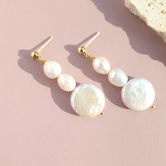 Experience timeless elegance and celebrate the art of craftsmanship in every pair. Elevate your style with jewelry that's as unique as you are. Choose these earrings to add a touch of sophistication and a dash of nature's elegance to your collection. Lightweight and versatile.  Handcrafted in USA. DETAILS: Material : 14k gold filled   Baroque Natural Pearls Dimensions:  Length 2" Note: each piece is totally handcrafted and made of natural pearls, and shapes can slightly vary ensuring no two are Baroque Pearl Earrings Gift, White Baroque Pearl Earrings For Gift, Single Baroque Earring As A Gift, Baroque Pearl Charm Earrings, Classic Baroque Earrings As Gift, Baroque Pearl Earrings As A Gift, Handmade Pear-shaped Pearl White Earrings, Baroque Pearl Dangle Bridal Earrings For Gift, Baroque Pearl Bridal Dangle Earrings For Gift