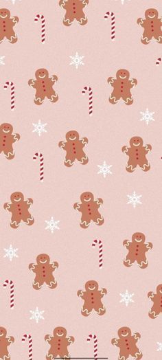 a pink background with gingerbreads and candy canes