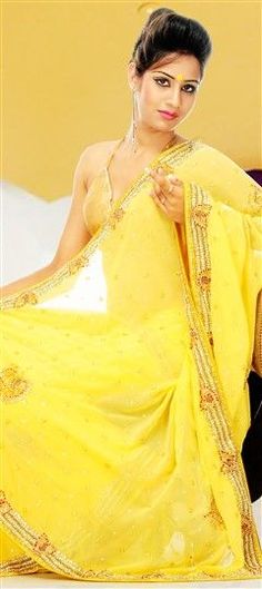 Yellow color Saree in Chiffon fabric with Cut Dana work Yellow Churidar With Sheer Dupatta, Yellow Chikankari Embroidery Saree For Reception, Yellow Georgette Churidar With Cutdana, Yellow Chikankari Embroidery Dupatta For Reception, Yellow Chikankari Embroidered Dupatta For Reception, Yellow Traditional Wear With Chikankari Embroidery For Reception, Yellow Georgette Traditional Wear For Wedding, Yellow Georgette Blouse Piece With Dori Work, Yellow Chinon Traditional Wear For Reception