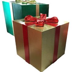 two wrapped gift boxes with red and green ribbons on them, one has a bow