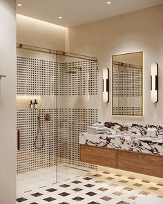 a bathroom with marble counter tops and two mirrors on the wall next to a walk in shower