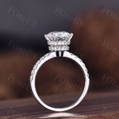 a white gold engagement ring with diamonds on it