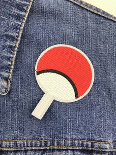 a patch on the back of a pair of jeans with a magnifying glass in it