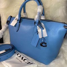 Coach Cara Satchel New With Tags And Original Packaging Dust Bag Included 100 % Authentic Pool Color With Pewter Color Hardware Soft Pebble Leather Zip Closure Handles With 4 1/2" Drop Long Strap With 21 1/2" Drop Included Four Protective Feet At Base Approximate Measurements 10 1/2" L X 7 1/2" H X 5 1/2" W Smoke And Pets Free Blue Textured Leather Top Handle Satchel, Coach Blue Top Handle Satchel, Blue Coach Top Handle Satchel, Light Blue Satchel With Detachable Handle, Blue Textured Leather Shopping Bag, Chic Blue Coach Satchel, Blue Textured Leather Satchel, Formal Blue Coach Satchel, Coach Blue Satchel With Handles