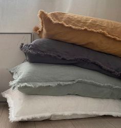 four pillows stacked on top of each other