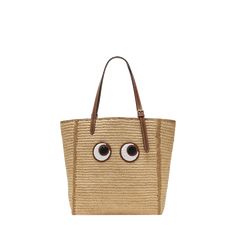 Anya Hindmarch raffia and leather north-south tote bag with embroidered eyes  Adjustable buckle shoulder straps  Open top  Interior, one slip pocket  Approx. 16.9"H x 15"W x 5.9"D Imported Small Eyes, Raffia Tote Bag, Anya Hindmarch, North South, Open Top, 16 9, Shoulder Straps, Tops Designs, Buckle