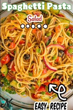 spaghetti pasta with vegetables and sauce in a glass bowl