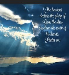 the sun shining through clouds over mountains with bible verse written in white on blue background