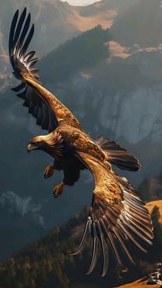 a large bird flying through the air with mountains in the background