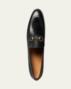 Gucci calfskin leather loafer. 0.5" flat heel. Apron toe. Rounded vamp. Golden bitstrap detail. Smooth outsole. Slipon style. "Jordaan" is made in Italy. Gucci Calf Leather Loafers With Rubber Sole, Elegant Gucci Loafers With Leather Footbed, Timeless Gucci Loafers With Leather Sole, Gucci Timeless Leather Sole Loafers, Timeless Gucci Slip-on Loafers, Timeless Gucci Loafers, Gucci Office Loafers With Rubber Sole, Office Gucci Loafers With Rubber Sole, Classic Gucci Calf Leather Shoes