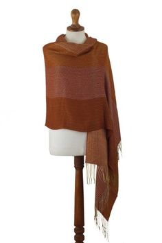 This vibrant wrap will work both as a shawl and a beautiful oversized scarf for cold winter days. Raquel and Gregor hand-weave it in a butter-soft baby alpaca blend and decorate it with a luxurious jacquard pattern in a warm combination of burnt orange amber and ochre tones. Raquel and Gregor aim to preserve their homeland's rich textile and weaving traditions through their work. Bohemian Alpaca Shawl For Fall, Brown Shawl Wrap For Fall, Traditional Woven Shawl For Fall, Fall Brown Shawl Wrap, Alpaca Shawl For Fall, Bohemian Alpaca Wrap For Fall, One Size Alpaca Shawl For Fall, Brown Alpaca Shawl For Fall, Orange Shawl Scarves For Fall