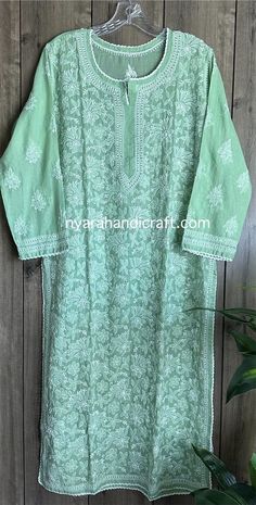 Soft cotton hand embroidered Kurta in a pretty sage green color ! Paired with soft cotton lined pants in white. Sold separately. Kurta Length:46 inches Liner included Spring Green Kurta With Cutdana, Spring Cotton Kurta With Lace Work, Green Cotton Sets With Floral Embroidery, Traditional Green Lace Work Sets, Traditional Green Sets With Lace Work, Green Lace Work Sets For Spring, Spring Pista Green Kurta With Chikankari Embroidery, Pista Green Kurta With Chikankari Embroidery For Spring, Bohemian Pista Green Kurta With Chikankari Embroidery