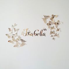 the word fabela surrounded by butterflies on a white background with gold foil lettering