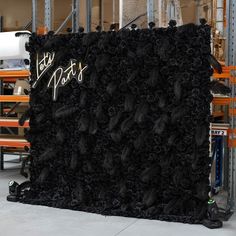 a large black piece of fabric with the words party pants on it and flowers in front