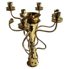 a golden candelabra with five candles on it