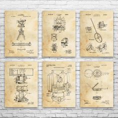 four blueprinted drawings of machinery on a brick wall