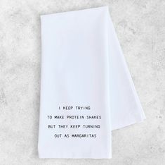 two white tea towels with the words every time i think i have my dishes in a row