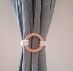 a curtain with a ring hanging on it