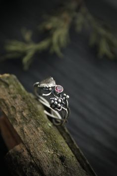 ITEM DESCRIPTION: The size of ring 7 1/2 (US and Canada) P (UK and AU) I can make it any size you want - just mark your size in the order Weight - 2 g. Absolutely amazing raspberry ring. I made it of sterling silver 925 and rhodolite garnet. I added two hand-fabricated highly detailed berries and a leaf around the stone. This Elven ring will be a great addition to your jewelry collection or a special piece for Engagement. This handmade ring will come to you in a gift box - ready for gifting. The Nature-inspired Round Flower Ring For Anniversary, Nature-inspired Ring For Wedding And Anniversary, Nature-inspired Open Ring For Anniversary, Nature-inspired Gemstone Flower Promise Ring, Unique Flower Ring For Anniversary, Unique Open Flower Ring For Anniversary, One Of A Kind Adjustable Wedding Ring, Nature-inspired Stackable Rings For Gifts, Nature-inspired Sterling Silver Wedding Gift