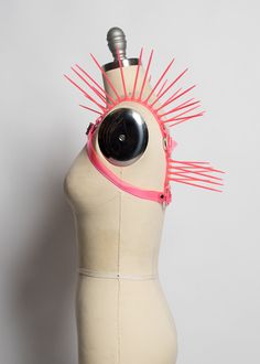 The neon version of the Replicant Chest Harness! Cyberpunk inspired harness made in colorful PVC. Dramatic spikes fan out at the shoulder to create a striking, avant garde, futuristic look. Fit is adjustable with buckle at chest. Silver-toned nickel plated steel hardware. Spikes are plastic zip ties/cable ties and are lightweight and flexible. Available in neon pink (shown) or lime green. Neon pink and neon orange PVC areUV reactive, the lime green PVC is NOT. All spikes colors are UV reactive. Edgy Adjustable Party Harness, Edgy Adjustable Harness For Party, Edgy Adjustable Harness For Parties, Adjustable Edgy Party Harness, Adjustable Punk Harness For Parties, Chest Harness, Rave Festival, Neon Orange, Make Time