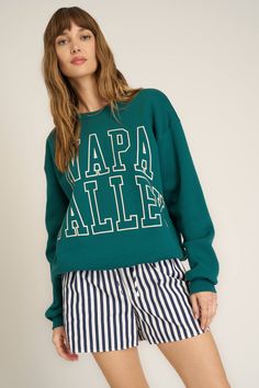 Napa Valley Arch Sweatshirt in Pacific Teal Fall Athleisure Sweater With Graphic Print, Sporty Tops For Fall Weekend, Sporty Tops For Weekend Fall Season, Sporty Top For Weekend Fall Season, Sporty Slogan Sweatshirt For Fall, Collegiate Text Print Sweatshirt For Fall, Casual Screen Print Sweatshirt For Fall, Casual Sweatshirt With Screen Print For Fall, Casual Fall Sweatshirt With Screen Print