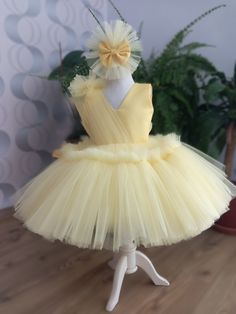 THİS DRESS IS READY TO SHIP IN 1 DAY. ❤️Make your little one's special occasion truly unforgettable with our breathtaking yellow tutu tule dress! Crafted from high-quality tule fabric, this adorable dress features layers of soft, fluffy tule that create a magical, princess-like appearance. The elastic waistband ensures a comfortable and secure fit for your baby or toddler, allowing them to move freely and enjoy their special day.  ❤️Perfectly suited for a wide range of events, from first birthdays and toddler parties to photo shoots and pageants, this versatile dress is a must-have for any little girl's wardrobe. The vibrant yellow hue adds a cheerful and festive touch, making it an excellent choice for milestone celebrations and capturing precious memories. Designed with an eye for detail Yellow Tutu Dress With Tulle Skirt For Spring, Spring Yellow Tutu Dress With Tulle Skirt, Yellow Tulle Tutu Dress For Party, Yellow Tulle Tutu Dress For Wedding, Yellow Tulle Skirt Tutu Dress For Party, Fitted Yellow Tutu Dress With Tulle Skirt, Elegant Yellow Tulle Tutu Dress, Yellow Ruffled Tutu Dress For Wedding, Yellow Tulle Tutu Dress For Spring