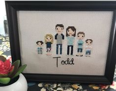 a cross stitch picture with the word toot on it and some flowers next to it