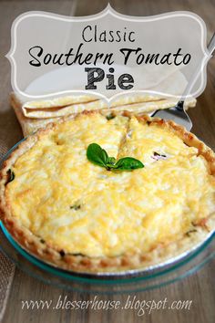 a close up of a pie on a table with a sign above it that says classic southern tomato pie