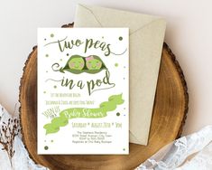 two peas in a pod baby shower card on top of a wooden slice with lace