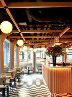 an empty restaurant with tables and chairs