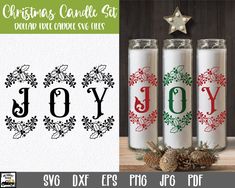 three christmas candles with the word joy on them