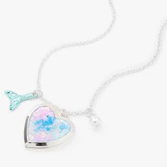 Keep special beach memories close to your heart with this locket necklace! A silver-tone chain features a heart shaped locket with colorful sparkles, a faux pearl charm, and a faux turquoise mermaid tail charm. Finish: Silver-tone Length: 16" + 3" extender Closure: Lobster clasp Material: Metal - Claire's Silver Mermaid Heart Locket Pendant Necklace Mermaid Jewelry Necklaces, Little Mermaid Necklace, Mermaid Melody Necklace, Silver Sterling Silver Mermaid Necklaces, Birthday Girl T Shirt, Mermaid Locket, Bitty Baby American Girl, Tie Dye Heart, Silver Mermaid