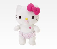 a white hello kitty stuffed animal with a pink bow